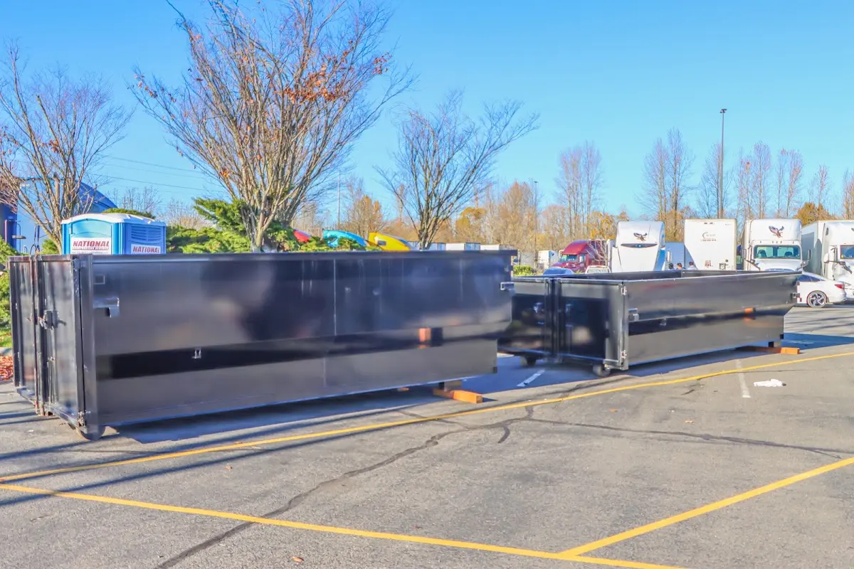 Professional dumpster rental service with roll-off container on residential driveway in Culpeper